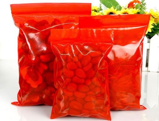 el sello reconectable a prueba de polvo del apretón de la prenda impermeable plástica del ziplock de la categoría alimenticia del LDPE del color rojo empaqueta