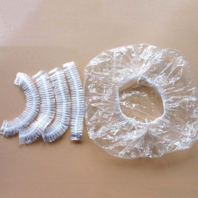 Ducha disponible elástico clara del hotel que baña los casquillos del salón de la cubierta del protector del cuidado del cabello